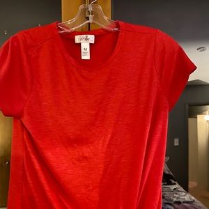 Knotted red T-shirt.